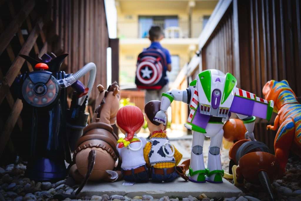 The cast of Toy Story with a boy with a Captain America backpack. Takes me back to my childhood!