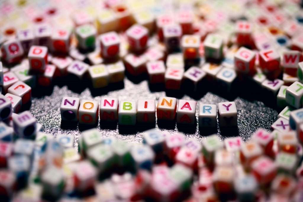Non-binary arranged in scrabble letters 