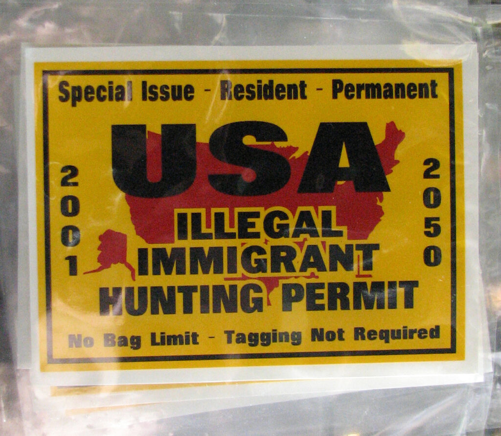 a sign with anti immigration rhetoric, reading "Illegal Immigrant Hunting Permit"