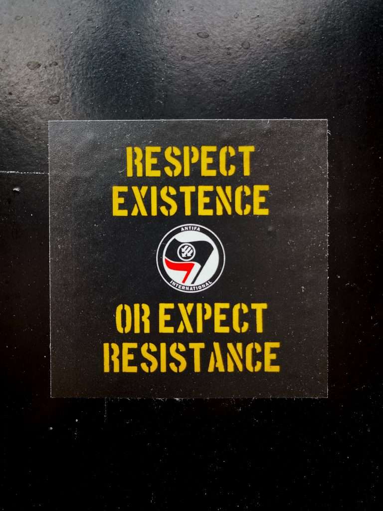 An Antifa sign reading "Respect existence or expect resistance"